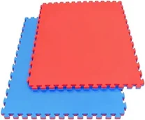 Two large interlocking foam mats with jigsaw edges, one red and one blue.