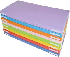 A stack of folded gym mats in many colours, the top one lilac.