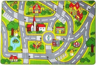 A play mat printed as a road map, with a school, houses, trees and a roundabout joined by grey roads.