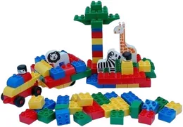 Large plastic building bricks built into a car and an enclosure holding a lion, a zebra and a giraffe.