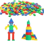 A wide heap of small ridged plastic blocks in red, blue, green and yellow, with a figure and a tower built from them standing in front.