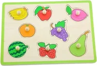 A wooden inset puzzle with a green border holding six pegged fruit pieces, a banana, an apple, a mangosteen, an orange, grapes, a watermelon slice, a strawberry and a pear.