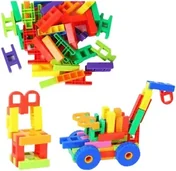 H-shaped interlocking plastic pieces in many colours, heaped above a chair and a wheeled cart built from them.