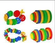 Four arrangements of large plastic buttons: two threaded chains and two stacked columns, in red, blue, green and yellow.