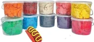 Ten tubs of modelling dough stacked in two rows, in orange, red, cream, blue, yellow, green, grey and pink, with a small yellow roller in front.