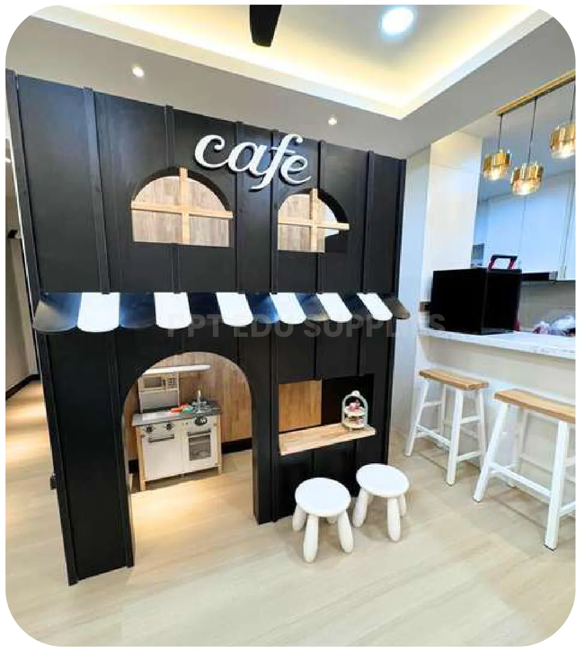 A cafe counter built into a homestay, lettered cafe, with striped awnings over the serving hatches and two stools in front.