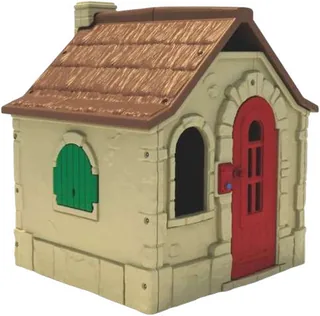 A moulded plastic cottage in stone-effect cream with a brown thatched roof, a red arched door and a green shuttered window.
