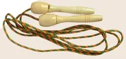 A skipping rope with turned plain wooden handles and a green and orange braided cord, coiled loosely.