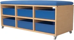 A low birch bench on castors with a padded blue seat cushion and six blue plastic trays in two rows underneath.