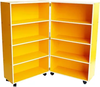 A yellow bookcase hinged down the middle and standing open at a right angle, four shelves in each half, on castors.