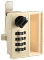 A cream combination lock with a black turning knob and four numbered dials, mounted on a short section of cabinet edge.