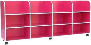 A long low pink unit on castors, its back rising into four curved fins, divided into open compartments in two rows.