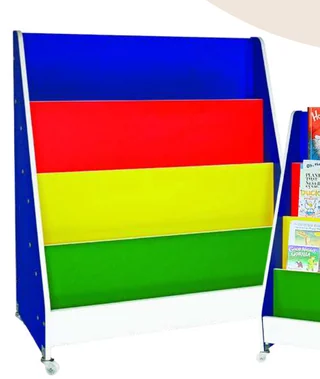 A sloped book shelf on castors with blue sides and blue, red, yellow and green tiers; a second unit of the same shelf, holding books, stands at the edge of the frame.