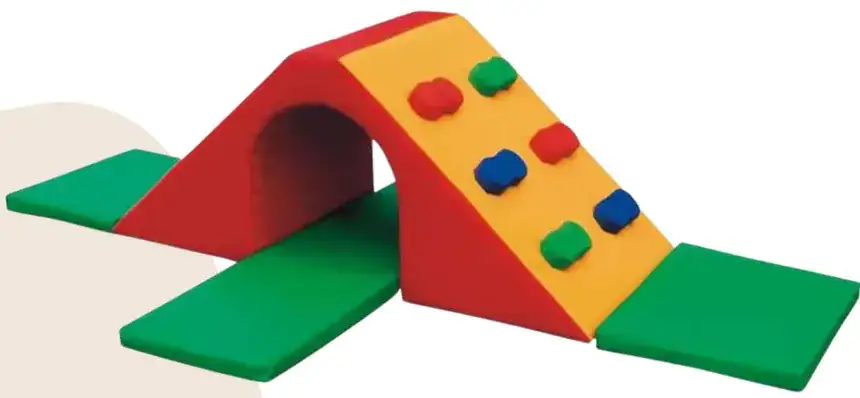 A red and yellow arch with coloured climbing knobs and a green mat each side.