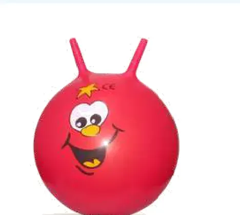 A red hopper ball with a printed face and two horn handles.